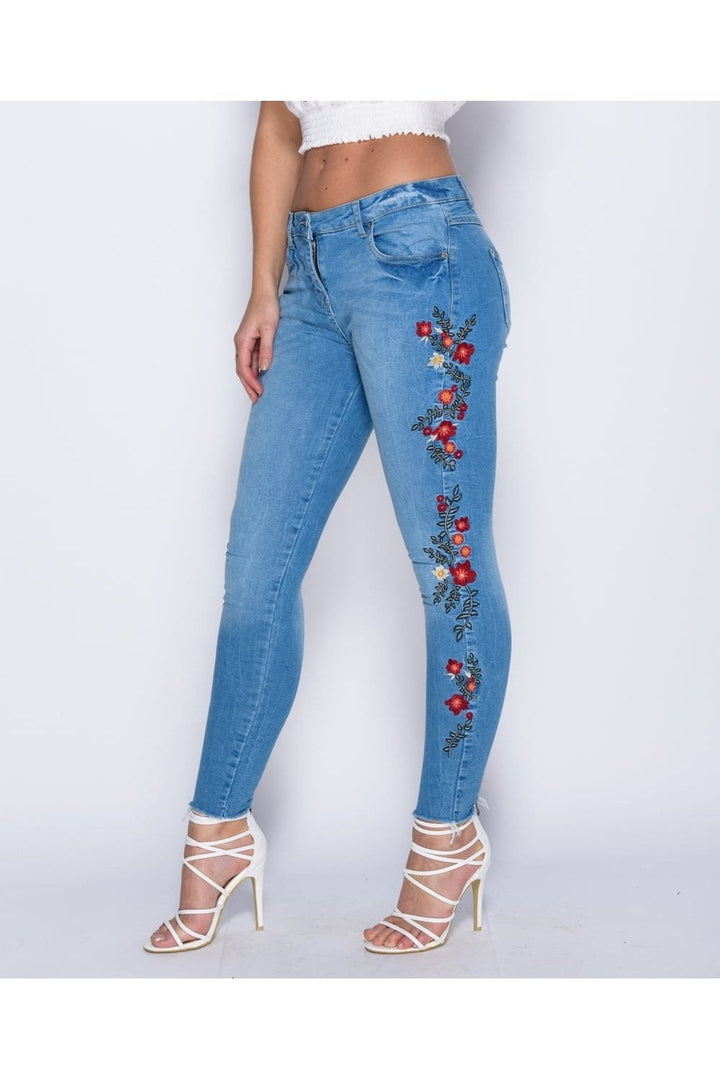 Blue Frayed Hem Jeans with Floral Embroidery Close Up Side View